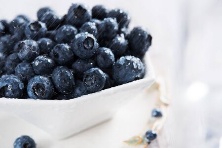 Fresh blueberries in white bowlの写真素材