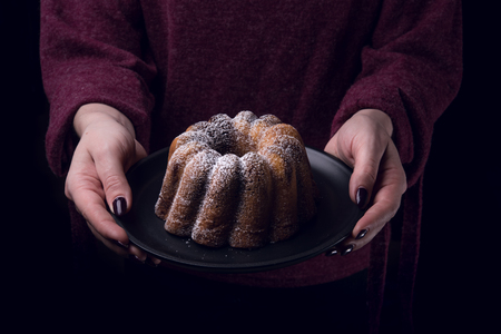 Woman holding a easter pound cakeの写真素材