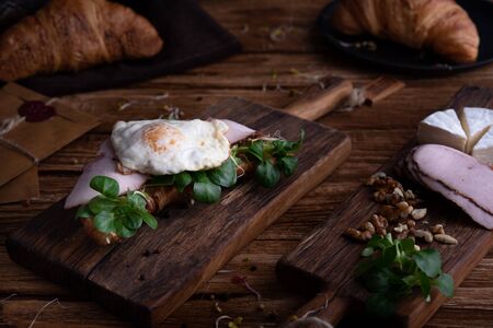 Healthy croissant for breakfast on dark backgroundの写真素材