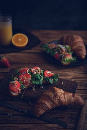 Healthy croissant for breakfast on dark backgroundの写真素材