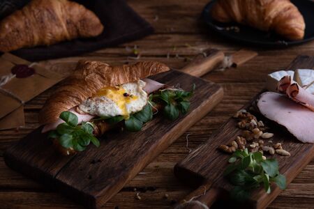 Healthy croissant for breakfast on dark backgroundの写真素材