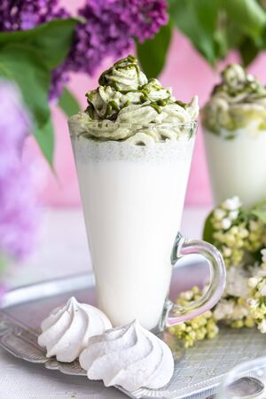Green tea matcha milk drink on rural backgroundの写真素材