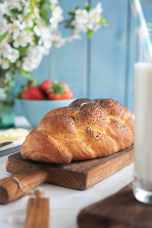 Fresh challah bread for breakfast on rural backgroundの写真素材