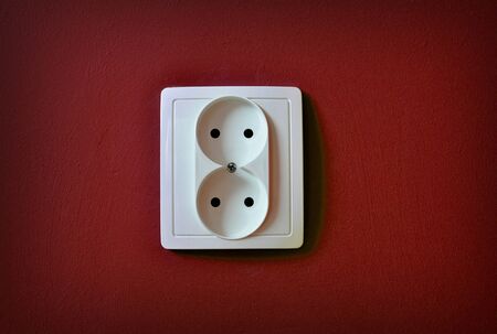 Alone outlet on wall background
