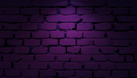 Purple bricks wall with spotlight backgroundの写真素材