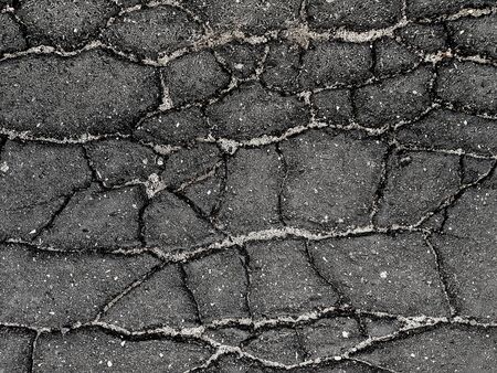 Black cracked asphalt texture.の写真素材