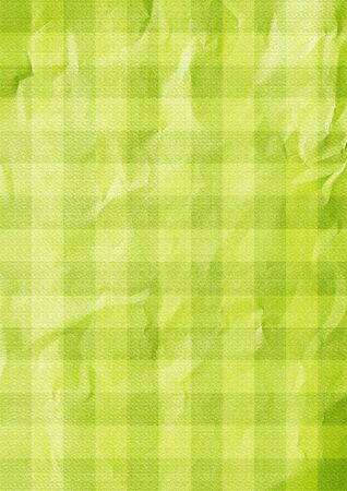 Green background. Tablecloth tartan pattern. Folded paper texture.の写真素材