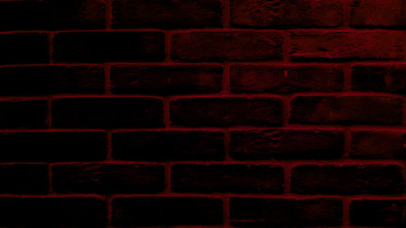 Dark spotlight brick wall texture background.の写真素材