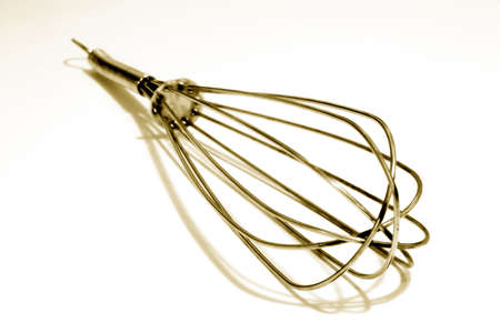Toned photograph of a wire whisk