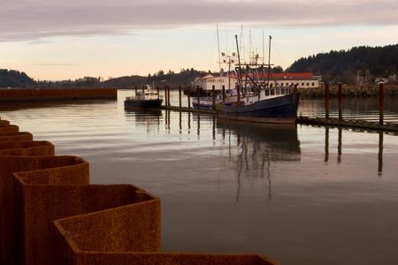 Photo of a fishing boats at sunset.の写真素材