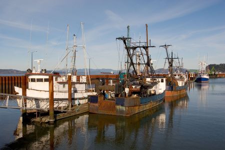 Photo of old  fishing boats docked at the East Mooring Basin in Astoria, Oregon.の写真素材
