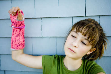 Photo of Maggie in a pink cast.の写真素材