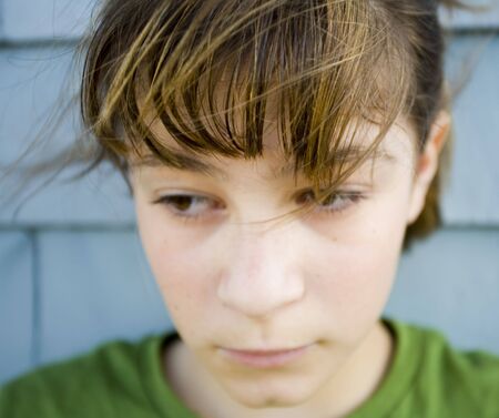 Photo of Maggie against blue wall