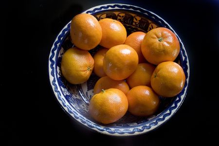 Photo of Oranges in Blue Bowlの写真素材