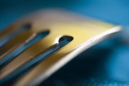 Photograph of sliver fork shot on blue background with narrow DOFの写真素材