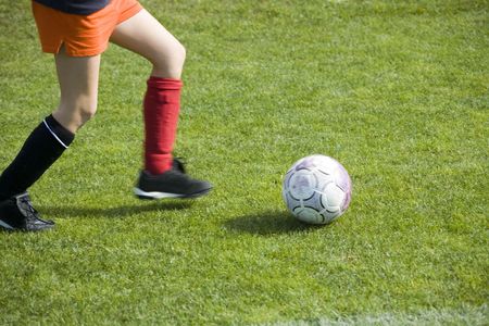 Girl Soccer Player Dribbling the Ballの写真素材