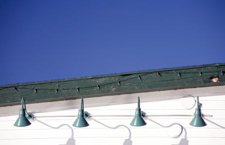 Photo of four green lights and blue sky.の写真素材