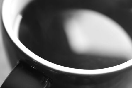 Photo of a red coffee cup on a green background.の写真素材