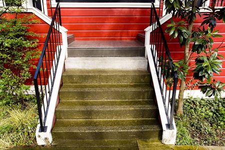 Photo of stairs leading to an attractive red duplex.の写真素材