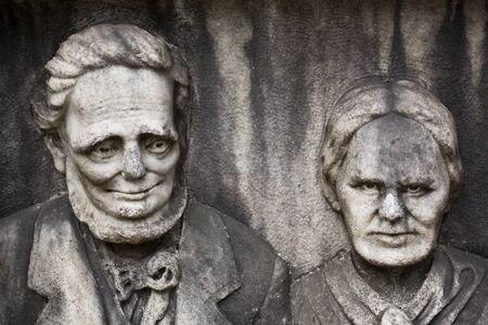 150-year-old statue in a public park of a gentle man and his crazy wife.のeditorial素材