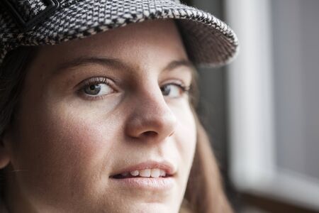 Portrait of a young woman staring straight ahead into the cameraの写真素材