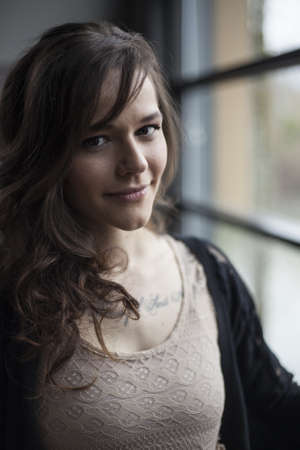 Portrait of a beautiful young woman with brown hair.