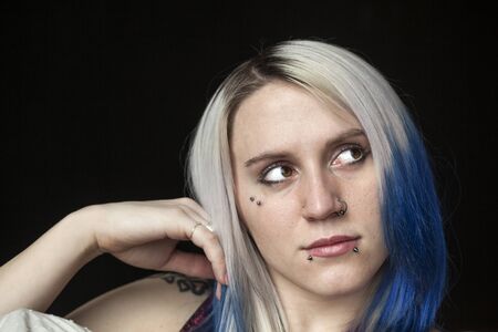 Portrait of a beautiful young woman with blue hair.の写真素材