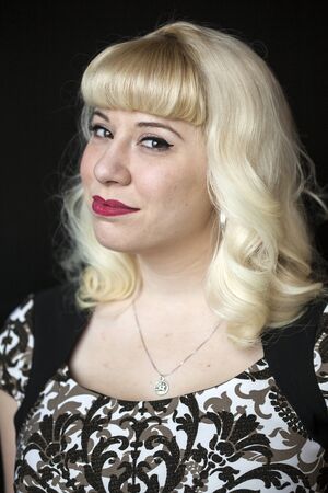Portrait of a beautiful young woman with blond hair and brown eyes.