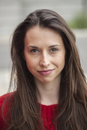 Beautiful young woman with brown hair and eyes.