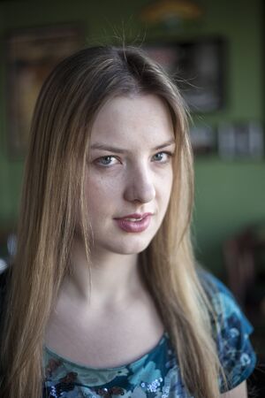 Portrait of a blonde woman with blue eyes.の写真素材
