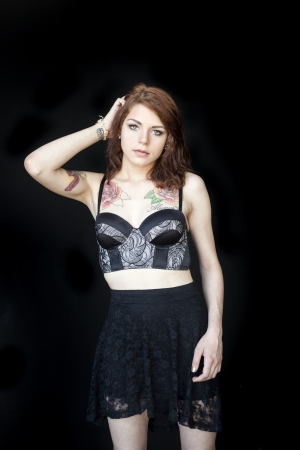 Portrait of a beautiful young woman in a black bustier.の写真素材