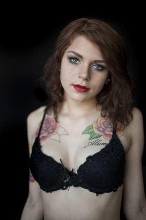 Portrait of a beautiful young woman in a black bra and panties.の写真素材