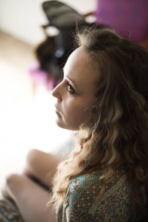 Head shot of a very attractive young woman with blond hair and brown eyes.の写真素材