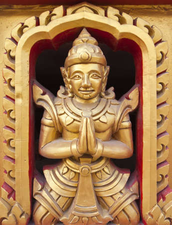 Thai statues on the temple wall の写真素材