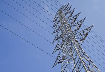 High voltage towers , on blue sky background 