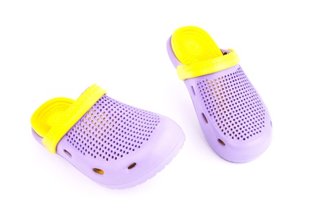 purple rubber sandals on a white background の写真素材