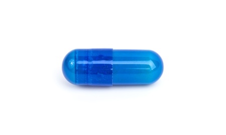 single blue capsule on a white background の写真素材