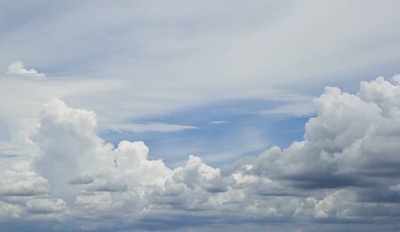 White fluffy clouds in the blue sky.