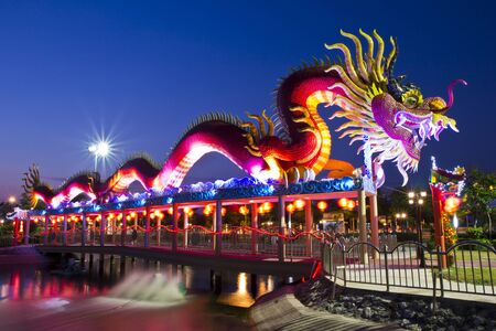 Large dragon statue in the park near dusk time.の写真素材
