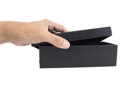 Hand opening the box black paper, isolated on white.の写真素材