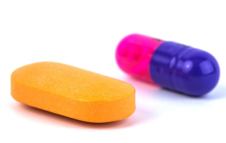 Vitamins and drugs isolated on white background.