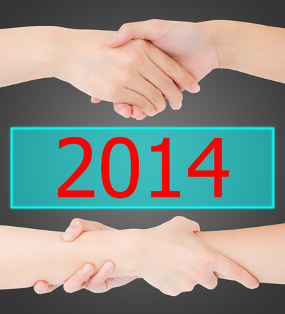 Two woman hands on 2014, isolated on whiteの写真素材
