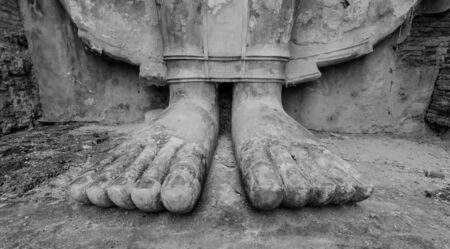 Feet of the old Buddha statue, black and white style