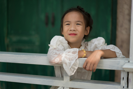 Happy Asian girl with Thai traditional dress.の写真素材