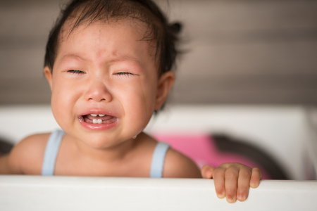 portrait of a crying  asian baby girlの写真素材