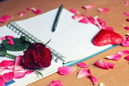 happy Valentines day on the romantic holiday the concept of condomRose and chocolate heart on pink background.の写真素材