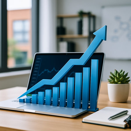 Laptop With Blue Arrow Up And Coin Stack 021125の素材