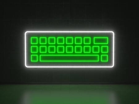 A green and white Neon Sign in Form of a Keyboard on a Wall of Concreteの写真素材