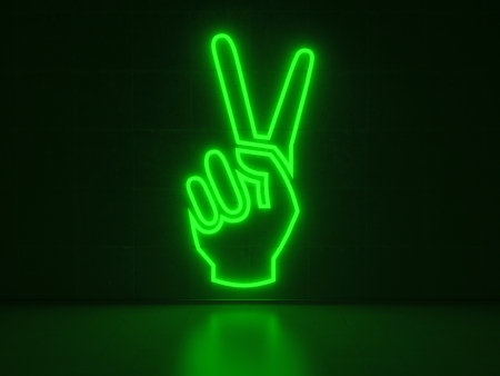 A green Neon Sign in Form of a Hand showing the Victory-Sign on a Wall of Concreteの写真素材
