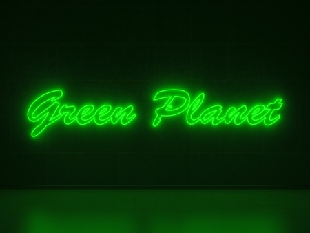 A green Neon Sign in Form of the Words Green Planet on a Wall of Concreteの写真素材